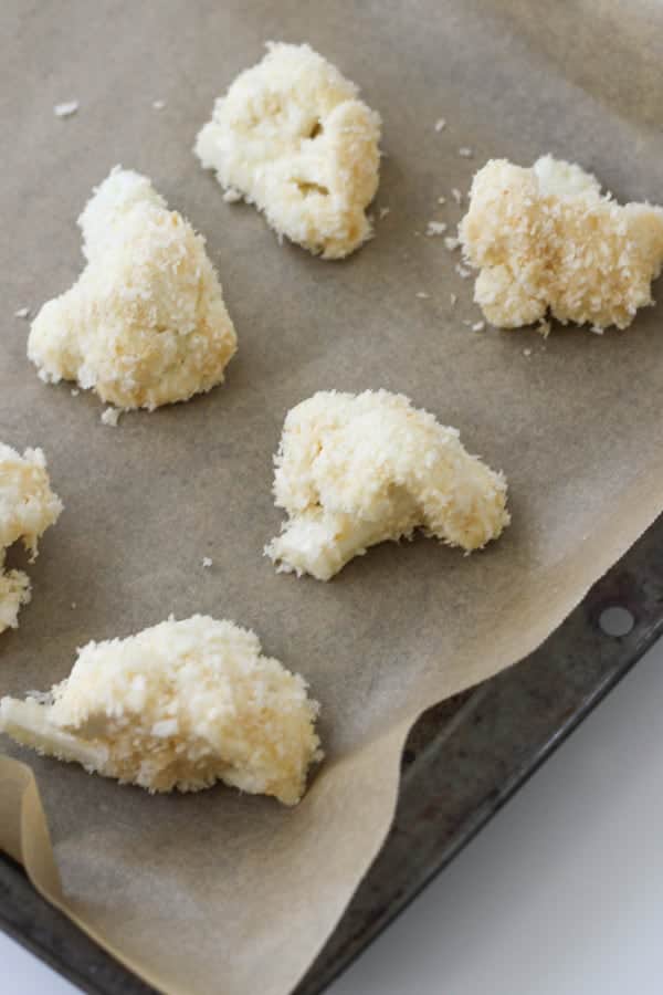 cauliflower pieces on a baking tray.