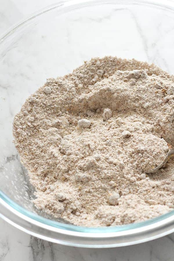 flour and sugar mixed together in a glass bowl.