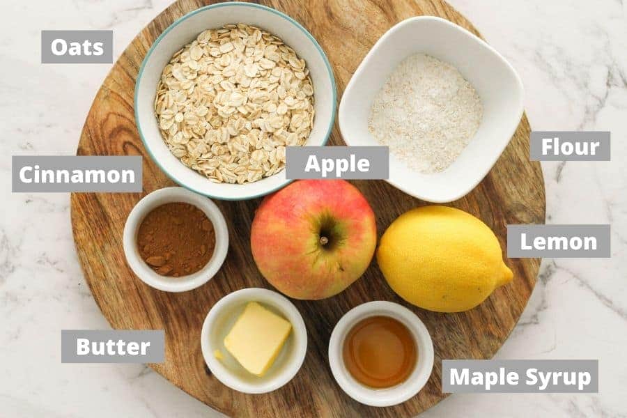 ingredients for apple crisp on a wooden board.