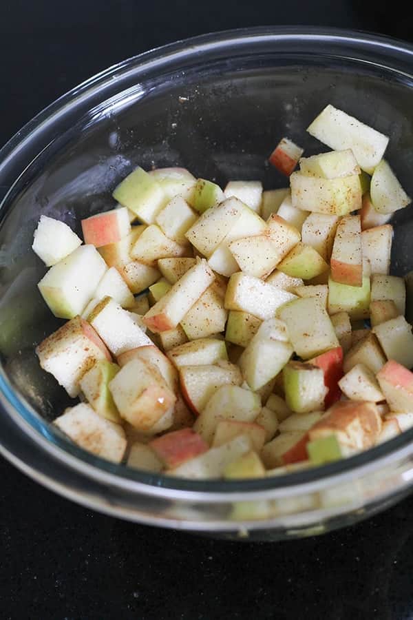 diced apples in a glass bowl.