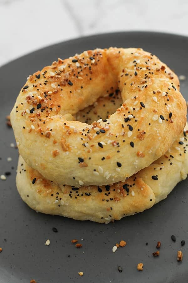 bagels stacked on a grey plate.
