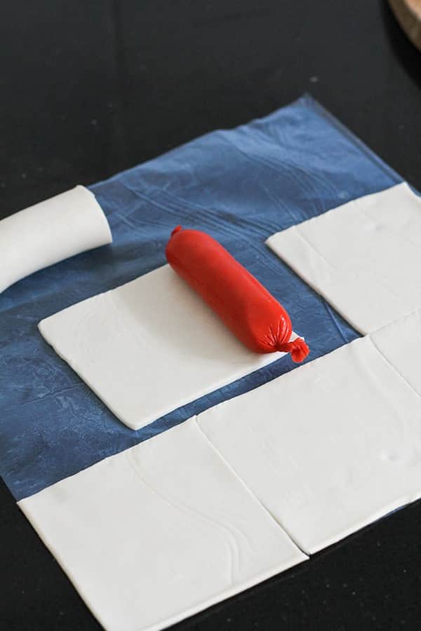 a cocktail frankfurt on a square of puff pastry.