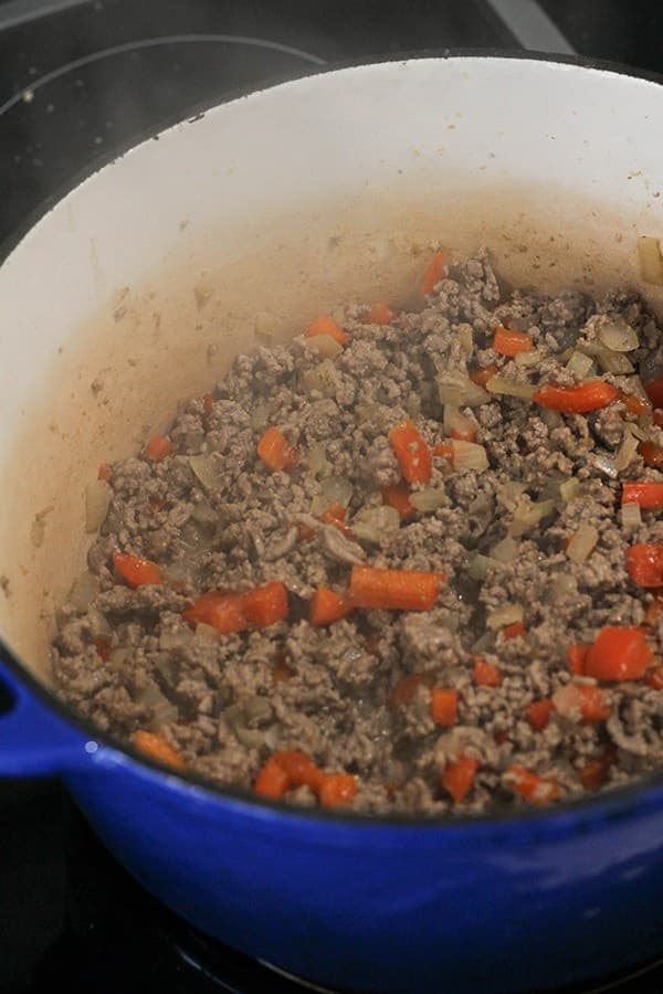 mince, onion and capsicum cooking in a large pot.