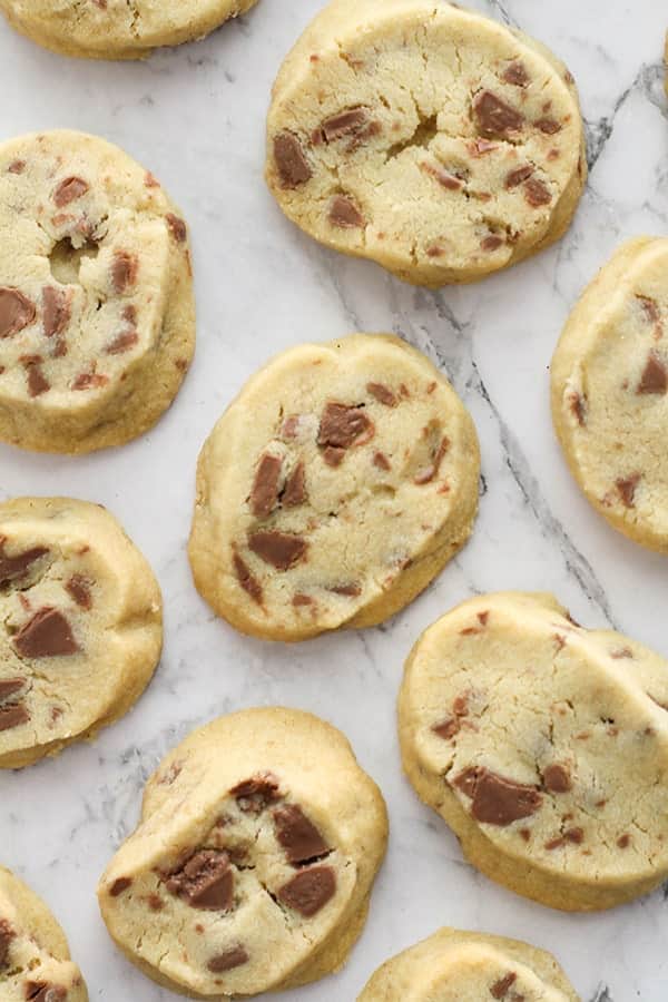 chocolate chip shortbread cookies on a marble background.