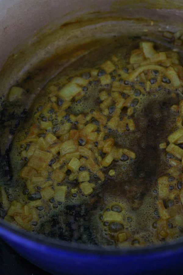 butter, onion and turmeric in a dutch oven.