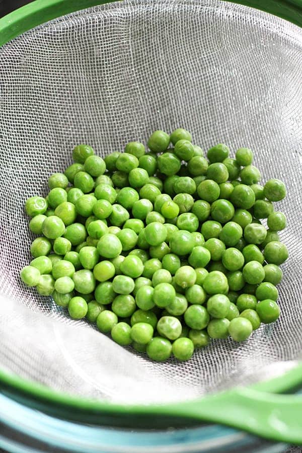 green peas in a colander.