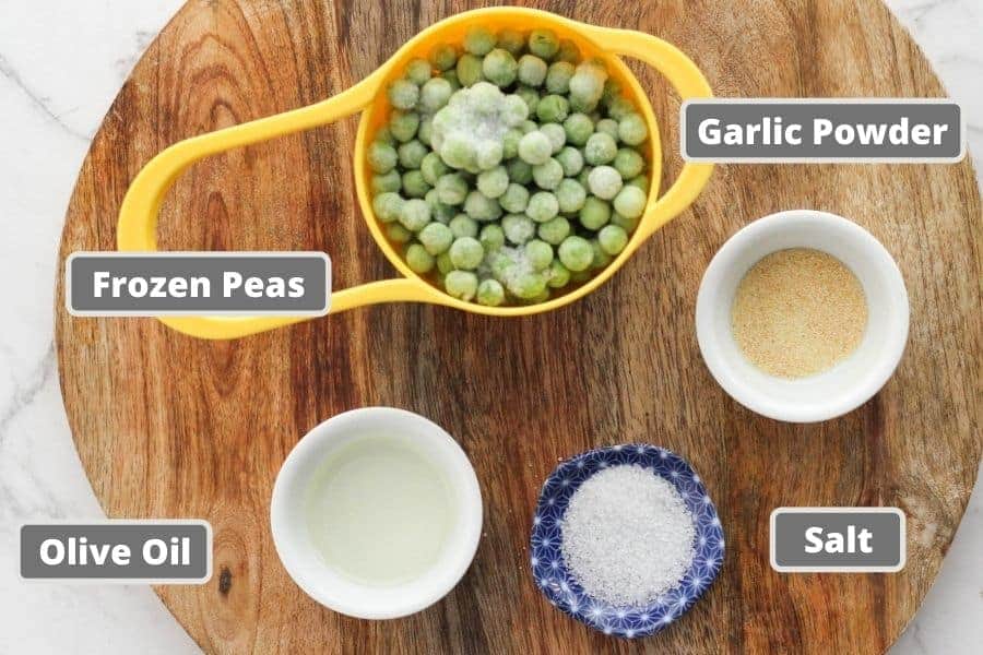 ingredients for roasted peas including green peas, garlic powder and olive oil.