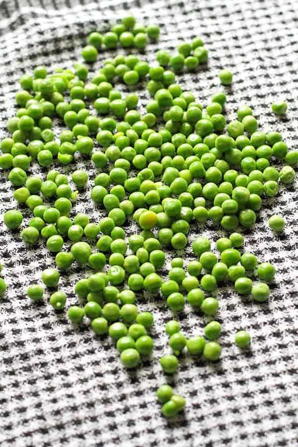 green peas on a kitchen towel.