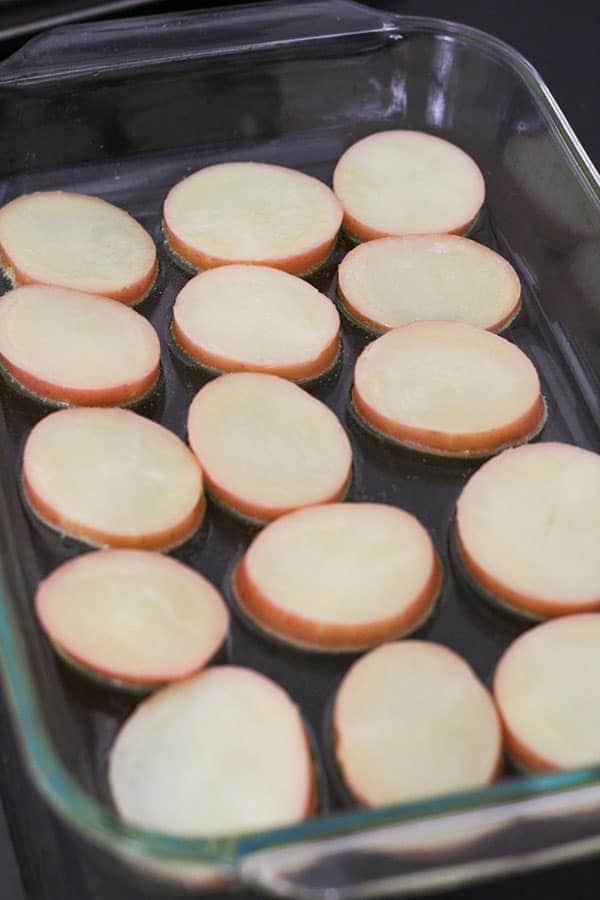 potato round in a large roasting dish.