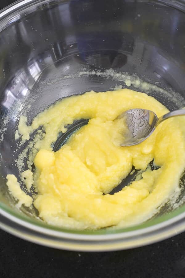butter and sugar mixed in a glass bowl.