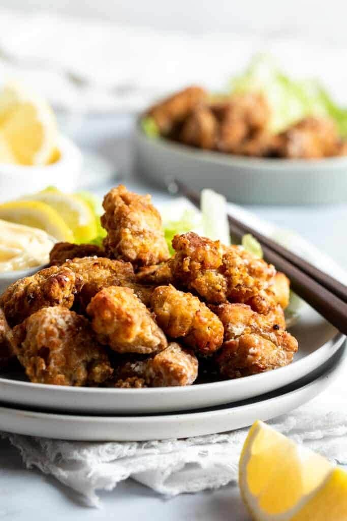 crispy karaage chicken on a grey plate.