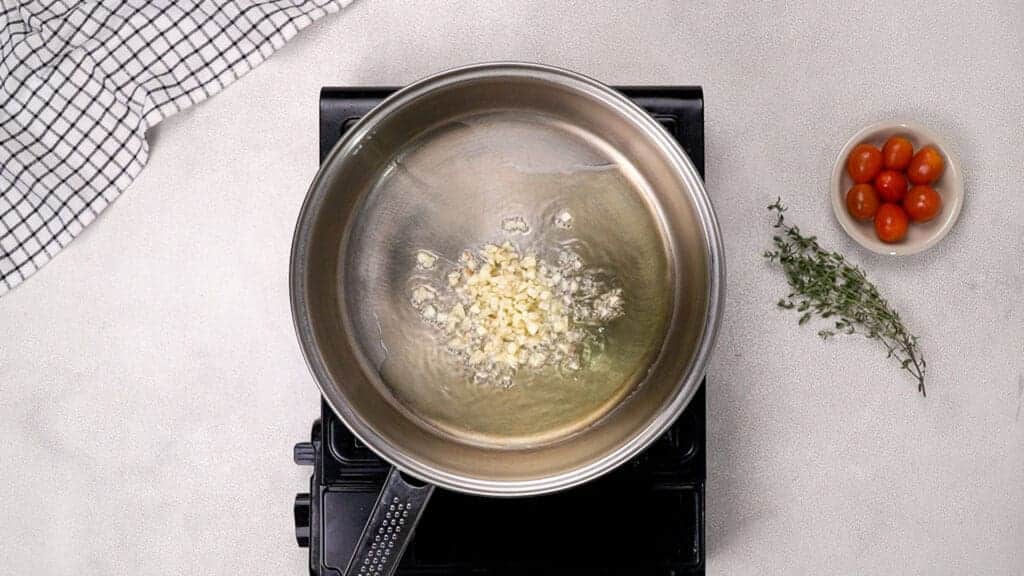 add minced garlic and stir